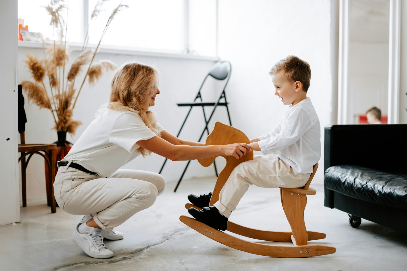 Child therapist working with young client through play therapy