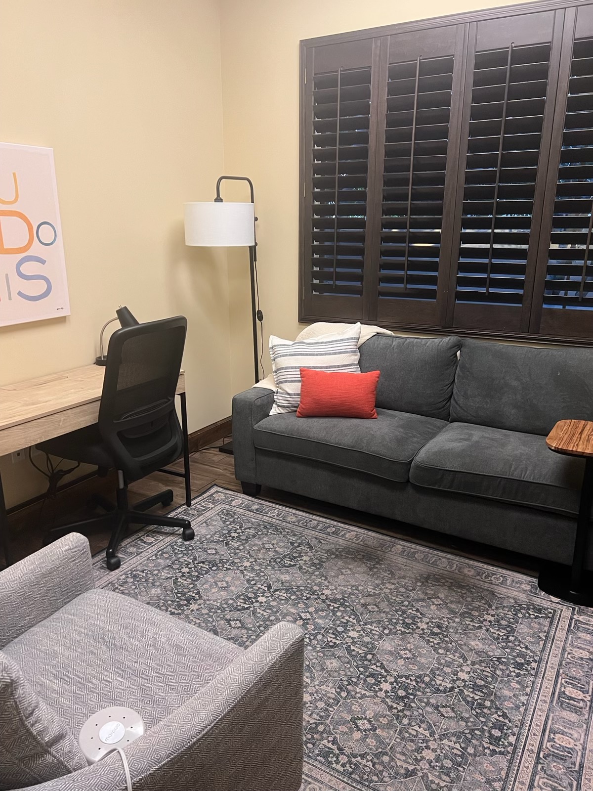 Therapy room with Second Story signage, desk and lounge seating